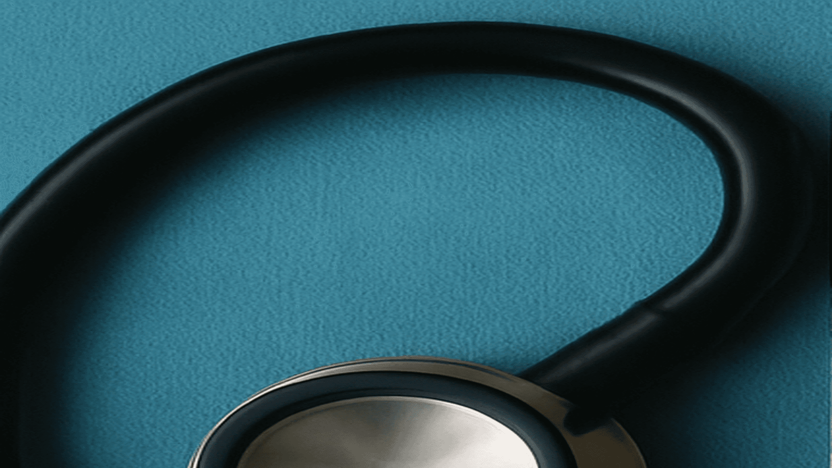 Stethoscope on a clinical surface representing long-term Crohn's care and repeated surgeries